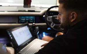 technician carrying out some coding work on a land rover defender