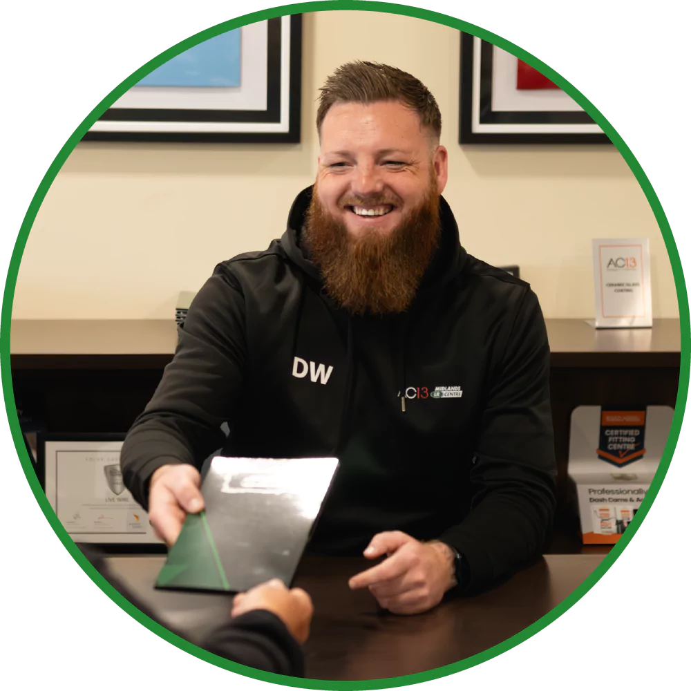 team member handing invoice to customer